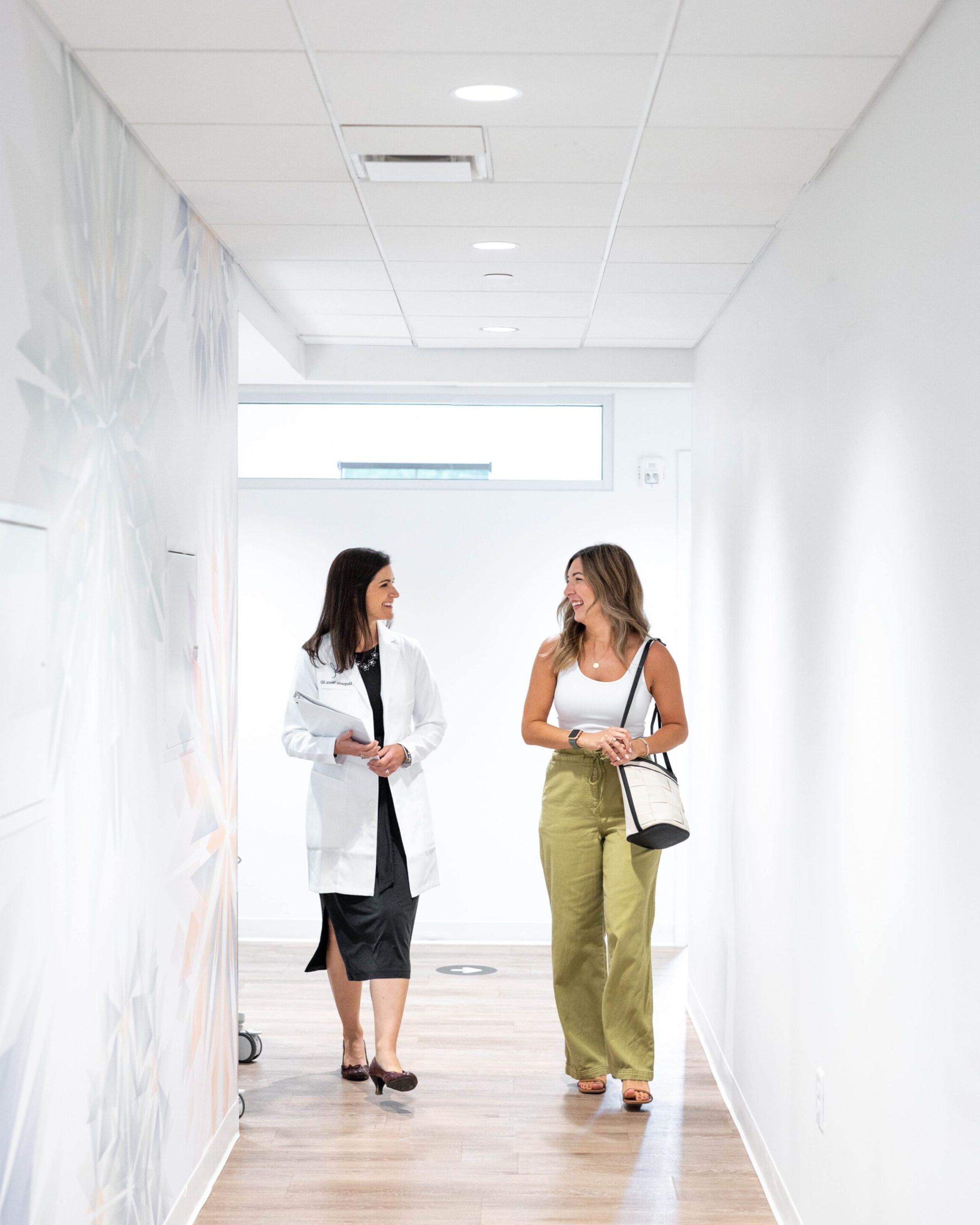 Dr. Weston walking down the hall with a patient